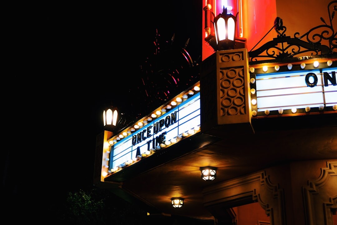 Cinema premiere entrance with soft lighting and elegant marquee