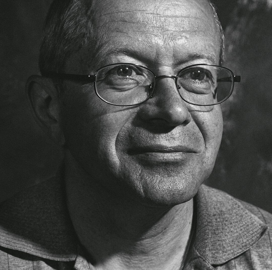 Studio portrait of an argentine man culture editor with glasses